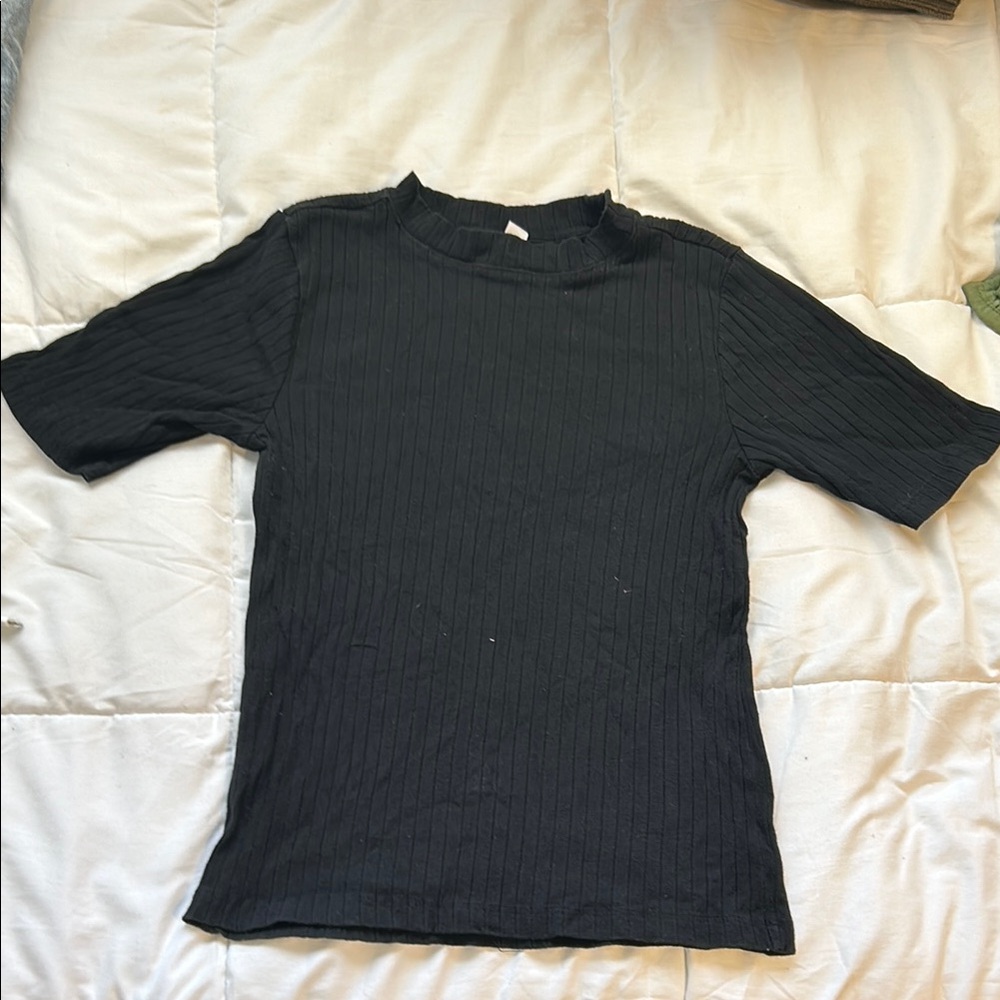 Black short sleeve, knit. Womens Sizes: Small
